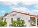 Exterior view of a white shop with red roof and string lights at 276 Thompson St, Alpharetta, GA 30009