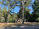 Cozy ranch house nestled among tall trees on a spacious lot at 272 Thompson St, Alpharetta, GA 30009