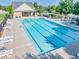 Community lap pool with lounge chairs and a pool house at 2694 Dawning Day Dr, Dacula, GA 30019