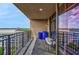 Spacious balcony with city views, wrought iron furniture, and large blue planters at 3286 Northside Nw Pkwy # 1007, Atlanta, GA 30327