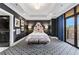 Stylish bedroom with a statement headboard and patterned carpet at 3286 Northside Nw Pkwy # 1007, Atlanta, GA 30327