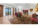 Elegant living room with ornate rug, hardwood floors, and French doors leading to balcony at 3286 Northside Nw Pkwy # 1007, Atlanta, GA 30327