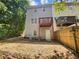 Private backyard with deck, wooden fence, and gravel ground at 158 Prospect Path, Hiram, GA 30141