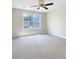 Bright bedroom with neutral walls, ceiling fan, and plush carpeting at 158 Prospect Path, Hiram, GA 30141