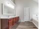 Bathroom boasts double vanity and a large soaking tub at 435 Tellico Sw Cir, Atlanta, GA 30331