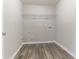 Laundry room with wire shelving and vinyl flooring at 435 Tellico Sw Cir, Atlanta, GA 30331