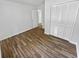 Bedroom with wood-look vinyl flooring and double door closet at 5351 Zachary Dr, Stone Mountain, GA 30083