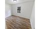 Simple bedroom with wood-look vinyl flooring and a window at 5351 Zachary Dr, Stone Mountain, GA 30083