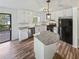 Bright kitchen features white cabinets, granite island, and stainless steel appliances at 5351 Zachary Dr, Stone Mountain, GA 30083