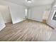 Main bedroom with vinyl flooring, walk-in closet, and en-suite bathroom at 5351 Zachary Dr, Stone Mountain, GA 30083
