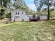 View of the home's back exterior, showcasing a deck and fenced yard at 5351 Zachary Dr, Stone Mountain, GA 30083