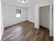 Bright bedroom with wood flooring and spacious closet at 5351 Zachary Dr, Stone Mountain, GA 30083