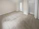 Spacious bedroom with neutral carpeting and large closet at 1097 Rock Creek Ln, Norcross, GA 30093