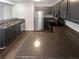 Updated kitchen featuring dark cabinetry and granite countertops at 1097 Rock Creek Ln, Norcross, GA 30093
