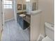 Bathroom with granite countertop and dark cabinets at 1097 Rock Creek Ln, Norcross, GA 30093