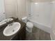 Updated bathroom with bathtub and granite vanity at 1097 Rock Creek Ln, Norcross, GA 30093
