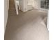 Living room featuring neutral carpeting and access to staircase at 1097 Rock Creek Ln, Norcross, GA 30093