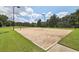 Sand volleyball court with net and surrounding grass at 41 Foxcroft Way, Villa Rica, GA 30180