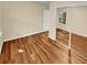 Bedroom with mirrored closet doors and hardwood floors at 309 Quail Run, Roswell, GA 30076