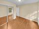 Bright bedroom with mirrored closet doors and wood flooring at 309 Quail Run, Roswell, GA 30076
