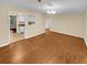 Bright dining room with wood flooring and kitchen view at 309 Quail Run, Roswell, GA 30076