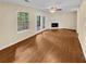Spacious living room featuring a fireplace and wood flooring at 309 Quail Run, Roswell, GA 30076
