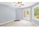 Simple bedroom with carpet, french doors and large window at 3850 Shady Grove Rd, Carrollton, GA 30116