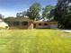 Brick ranch house with a carport, porch, and well-maintained lawn at 4128 Snapfinger Way, Decatur, GA 30035