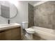 Modern bathroom with a large tiled shower, bathtub and floating vanity at 4128 Snapfinger Way, Decatur, GA 30035