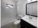 Clean bathroom with a tub, toilet and vanity at 4128 Snapfinger Way, Decatur, GA 30035