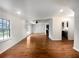 Bright living room with hardwood floors and access to the kitchen and dining area at 4128 Snapfinger Way, Decatur, GA 30035