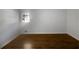 Bright bedroom with hardwood floors and a large window at 4128 Snapfinger Way, Decatur, GA 30035