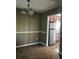 Simple dining room with light brown carpet and view into kitchen at 9184 S Sterling Lakes S Dr, Covington, GA 30014