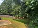 Backyard with a wooden fence and green grass at 9184 S Sterling Lakes S Dr, Covington, GA 30014