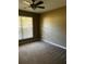 Bright bedroom with large window and ceiling fan at 9184 S Sterling Lakes S Dr, Covington, GA 30014