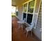 Covered front porch with white metal furniture at 9184 S Sterling Lakes S Dr, Covington, GA 30014