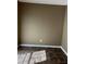 Small room with brown walls and dark tile floors at 9184 S Sterling Lakes S Dr, Covington, GA 30014