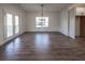 Sunlit dining room with hardwood floors and access to deck at 1147 Red Oak Blvd, Loganville, GA 30052