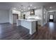Spacious kitchen with island, stainless steel appliances, and hardwood floors at 1147 Red Oak Blvd, Loganville, GA 30052