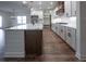Modern kitchen with white cabinets, quartz countertops and stainless steel appliances at 1147 Red Oak Blvd, Loganville, GA 30052