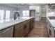 Eat-in kitchen with large island, quartz countertops, and stainless steel appliances at 1147 Red Oak Blvd, Loganville, GA 30052