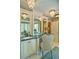 Elegant bathroom with a vanity, large mirror, and crystal chandelier at 2341 Habersham Sw Dr, Marietta, GA 30064