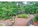 Brick patio with lush landscaping and gated entrance at 2341 Habersham Sw Dr, Marietta, GA 30064