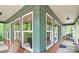 Screened porch with brick flooring and wooded views at 2341 Habersham Sw Dr, Marietta, GA 30064