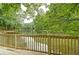 Wooden deck overlooking a serene lake, perfect for relaxation at 2341 Habersham Sw Dr, Marietta, GA 30064