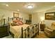 Elegant guest bedroom with a wrought iron bed frame and ornate decor at 2341 Habersham Sw Dr, Marietta, GA 30064