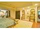 Elegant main bedroom with a gold canopy bed and ample built-in storage at 2341 Habersham Sw Dr, Marietta, GA 30064