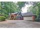 Brick home with a large driveway and mature trees at 2341 Habersham Sw Dr, Marietta, GA 30064