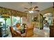 Charming breakfast room with glass-top table, four chairs, and access to a balcony at 2341 Habersham Sw Dr, Marietta, GA 30064