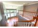 Spacious loft area overlooking the great room with neutral carpeting at 617 Vinings Estates Se Dr, Mableton, GA 30126